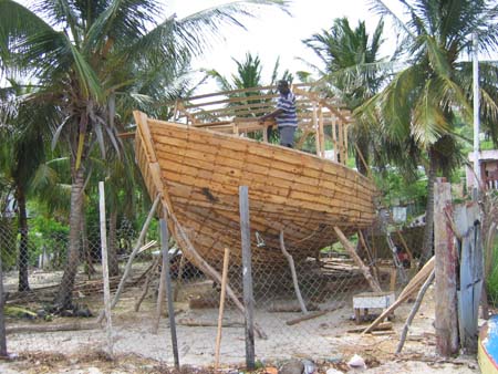 building boats on the beach in Petite Martinique